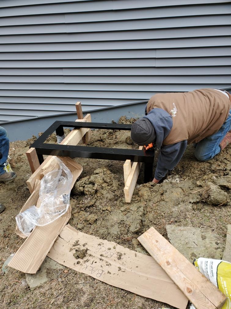 Setting a generator stand in concrete